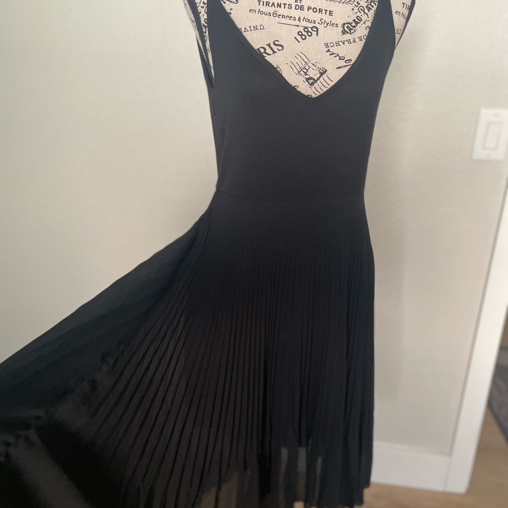 Chic Black Dress with Flowing Hemline